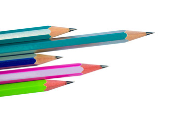 Few different colored wood pencil crayons placed beside one another on white background