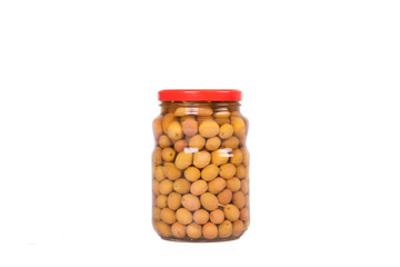 Small green olives in glass jar isolated