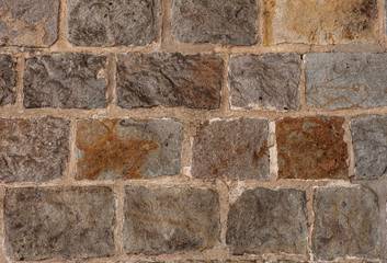 Close-up stone wall.
A medieval stone wall.  Abstract background with stone texture. 