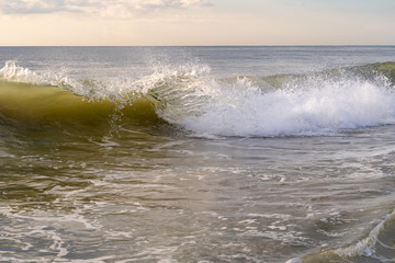 Morning sunrise and waves at the beach