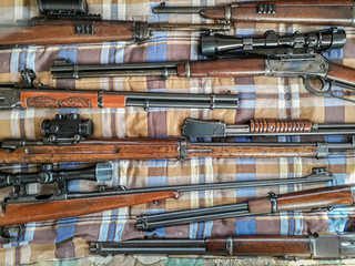 Rifle Collection Over Blank Sheet