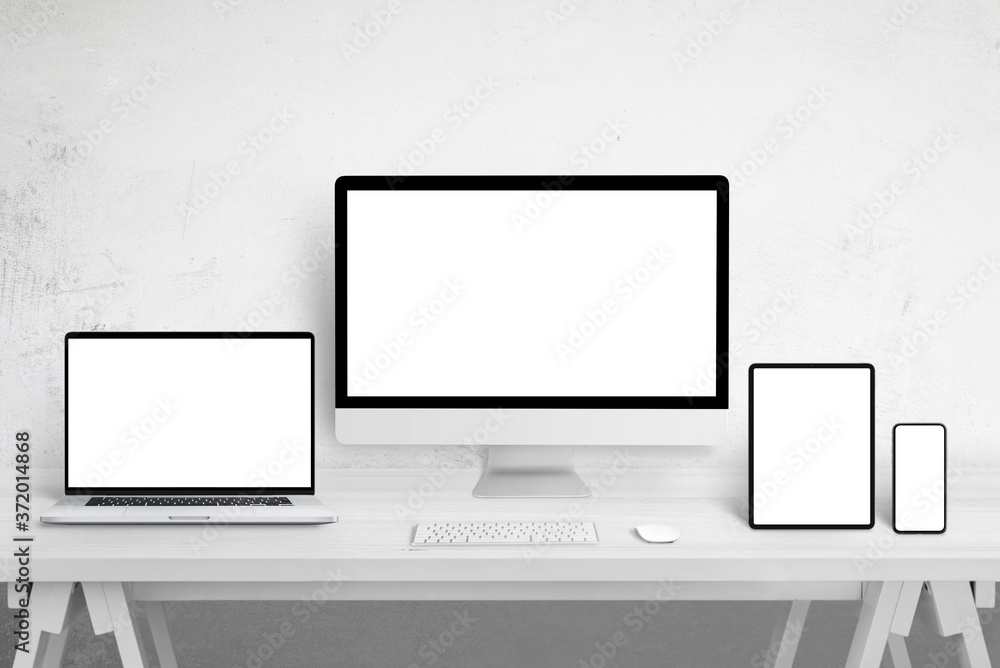 Poster Responsive devices mockup for web site design promotion on different display sizes. Isolated white screens. White wooden table