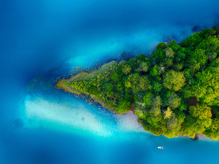 Island aerial shot on Faaker See lake in Carinthia, Kärnten, Austria