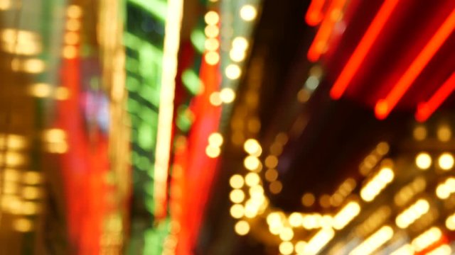 Defocused old fasioned electric lamps glowing at night. Abstract close up of blurred retro casino decoration shimmering, Las Vegas USA. Illuminated vintage style bulbs glittering on Freemont street.