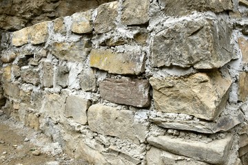 Stone wall background with concrete.