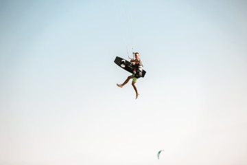 Kitesurfing Kiteboarding action photos man among waves quickly goes