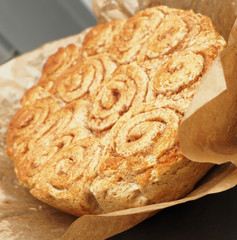 Sweet and tasty cinnamon pastry on baking paper