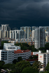 Singapore city skyline before heavy rain. Very dark clouds.
