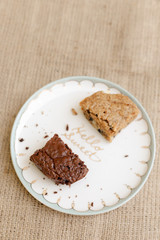 Fototapeta na wymiar brownie and butterscotch on a plate flatlay