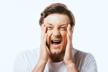 Scared man with hands near face looking at camera isolated on white