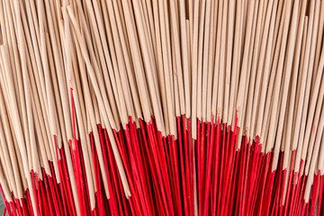 Background image of incense piled up in a temple