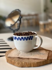 Dark coffee on wooden plate