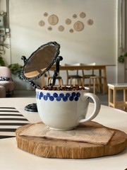 Dark coffee on wooden plate