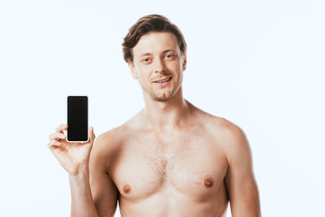 Fototapeta premium Shirtless man showing smartphone isolated on white