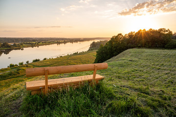 Obraz premium View from ancient Aizkraukle castle mound to the river Daugava at sunset hour in August in Skriveri in Latvia