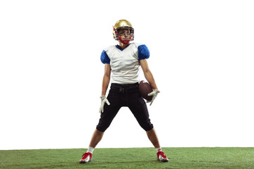 Confident posing. American football player isolated on white studio background with copyspace. Professional sportsman during game playing in action and motion. Concept of sport, movement, achievements