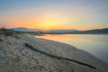 Sunrise over the sandbanks of an estuary
