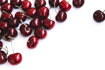 Background of ripe cherries on a white background