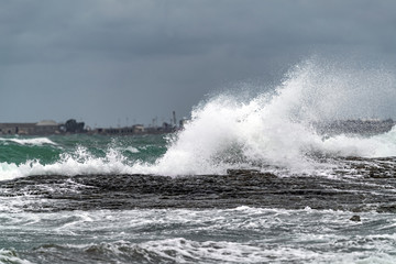 Big waves breaking coastal rocks
