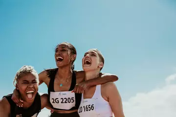 Foto op Plexiglas Group of female runners enjoying victory © Jacob Lund