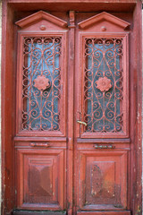 vintage entrance wooden brown door with glass close up