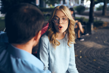 Fototapeta premium business man and woman sitting on bench communication technology work colleagues meeting