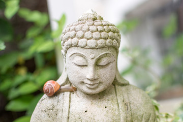 Stone Buddha with a Snail