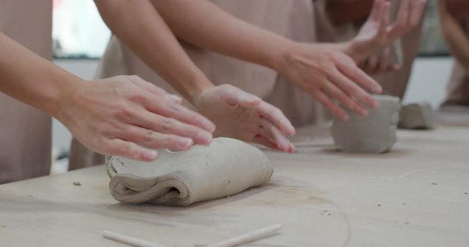 Kneading clay material before making pottery
