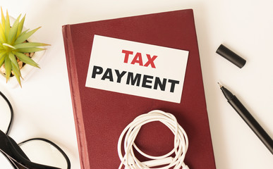 Tax planning-text inscription on the background of office supplies. Financial expenses for payment of required fees, duties and mandatory payments.
