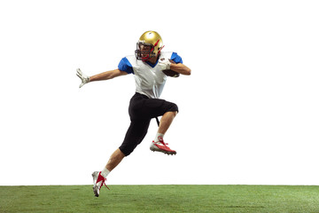 In jump, flight. American football player isolated on white studio background with copyspace. Professional sportsman during game playing in action and motion. Concept of sport, movement, achievements.