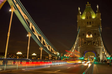 Fototapeta na wymiar Tower Bridge cars passing in time-lapse at night