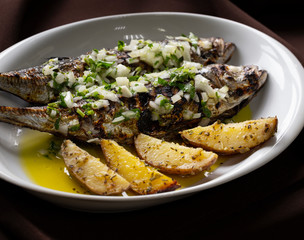 Grilled Horse Mackerel with Green Sauce and Potatoes is a typical plate from Mediterranean Food.