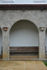 Arch facade wth wooden sitting bench