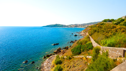 Fototapeta na wymiar Mediterranean sea shore in Piombino, Tuscany, Italy. Tourism destination, summertime vacation