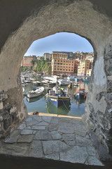 The characteristic seaside village of Camogli in the eastern Ligurian Riviera located between Recco and Rapallo. The heart of the town is in its characteristic porticcilo full of fishing boats and ple