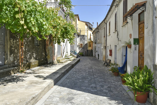 A narrow street among the old houses of Aieta, a rural village in the Calabria region.