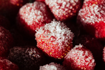 Frozen strawberries. Storage of frozen food. Freezing berries. Frozen foods.Strawberry in frost close-up macro.