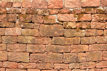 Old brick wall, old texture of red stone blocks closeup