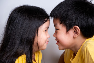 positive emotion of children, happiness, smiling, laughing, enjoy on white background. lovely relationship of brother and sister. portrait of children's feeling