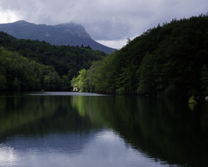 a view of a lake house in the Montseny mountain