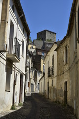 A narrow street among the old houses of Altomonte, a rural village in the Calabria region.