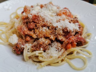 Spaghetti Bolonese with fresh bazil, tomates and parmesan cheese - tasty Pasta