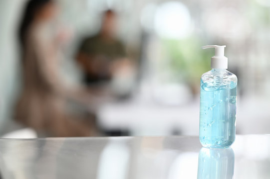 A Bottle Of Hand Sanitizer Is Putting On A Table In Meeting Room.