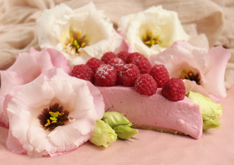 Raspberry cheesecake with berries and fresh flowers on pink plate food photo, sweet cake food photo art, kitchen, menu and restaurant photoshoot