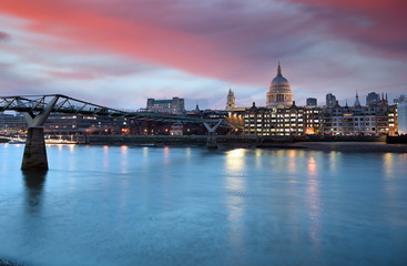 Fototapeta na wymiar A view across the River Thames at dusk towards St. Paul's Cathedral in London, UK.