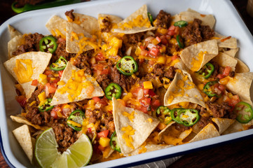 nachos in white iron pan