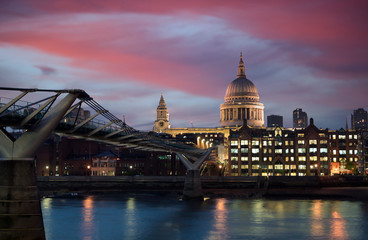 Fototapeta premium A view across the River Thames at dusk towards St. Paul's Cathedral in London, UK.