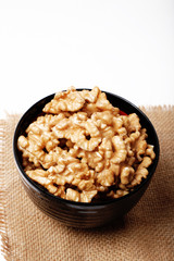 Walnut In Bowl Isolated On White Background.