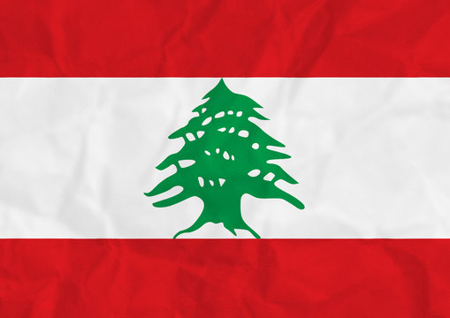 A distressed red white and green Lebanese flag illustration with crumpled paper texture