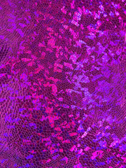 A sleek pink background made of beautiful fabric.